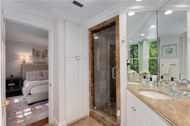1325 Peachtree St NE Unit 401, Atlanta, GA 30309 - ensuite bathroom with visible vents, ornamental molding, vanity, a stall shower, and ensuite bath