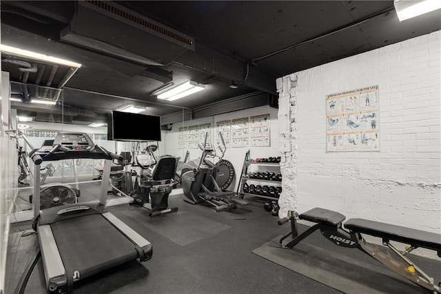 1325 Peachtree St NE Unit 401, Atlanta, GA 30309 - exercise room with brick wall