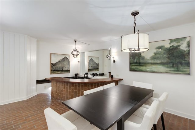 1325 Peachtree St NE Unit 401, Atlanta, GA 30309 - dining space with baseboards and brick floor