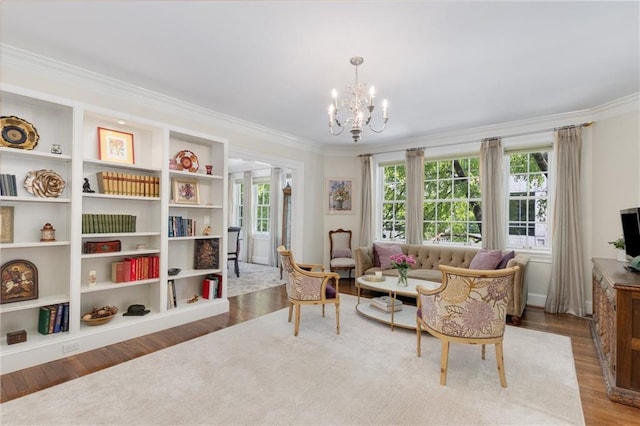 1325 Peachtree St NE Unit 401, Atlanta, GA 30309 - living area with crown molding, a chandelier, a wealth of natural light, and wood finished floors