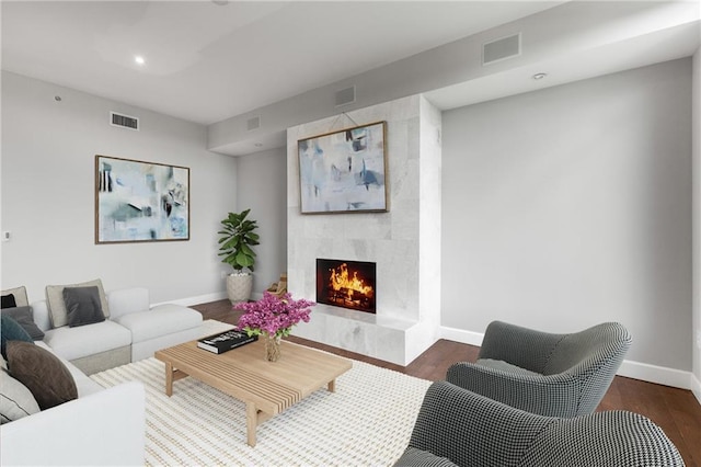 1820 Peachtree St NW Unit 804, Atlanta, GA 30309 - living room with a premium fireplace, wood finished floors, and recessed lighting
