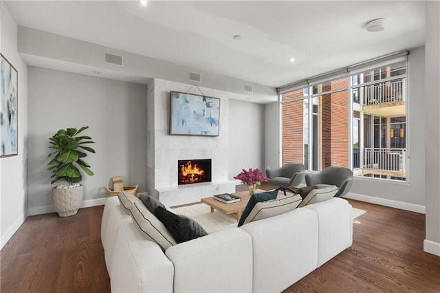 1820 Peachtree St NW Unit 804, Atlanta, GA 30309 - living room featuring a large fireplace, wood finished floors, and recessed lighting