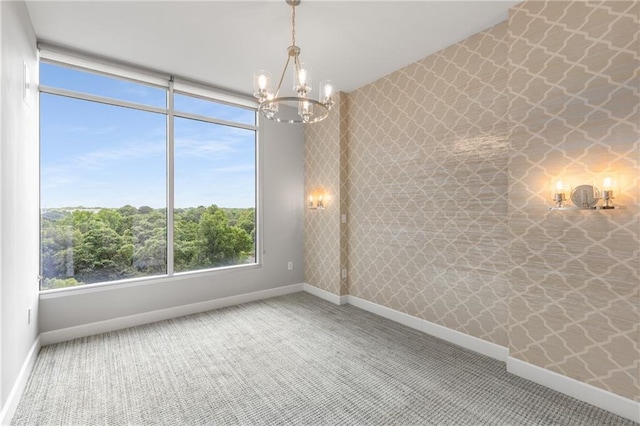 1820 Peachtree St NW Unit 804, Atlanta, GA 30309 - spare room featuring a chandelier and carpet flooring