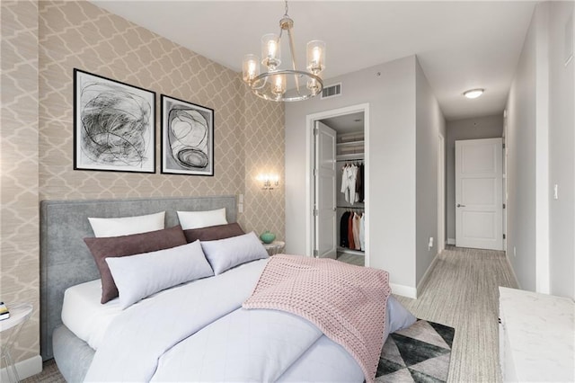1820 Peachtree St NW Unit 804, Atlanta, GA 30309 - carpeted bedroom featuring a chandelier and a closet