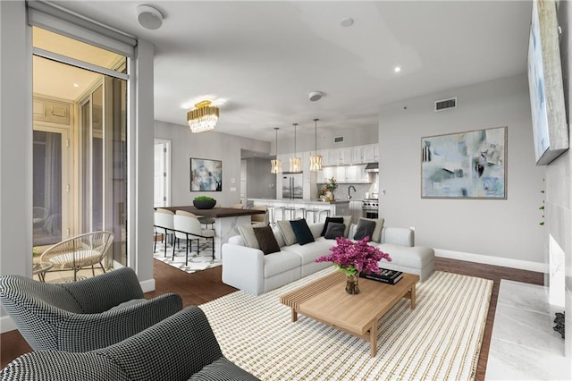 1820 Peachtree St NW Unit 804, Atlanta, GA 30309 - living room featuring wood finished floors and baseboards