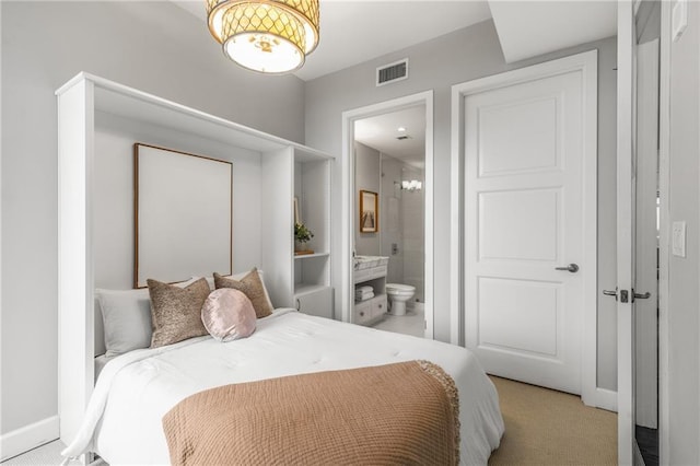 1820 Peachtree St NW Unit 804, Atlanta, GA 30309 - bedroom featuring a chandelier, connected bathroom, and light colored carpet