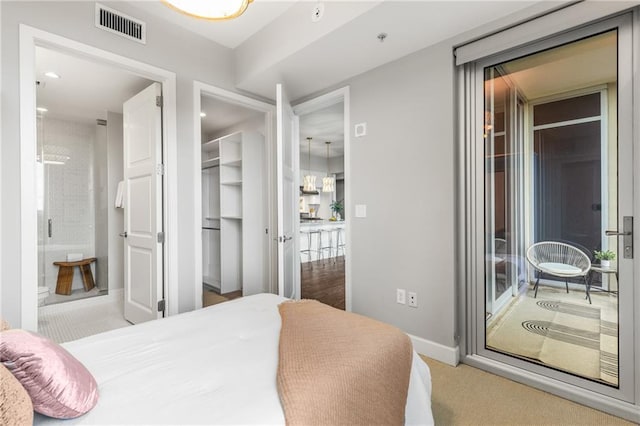 1820 Peachtree St NW Unit 804, Atlanta, GA 30309 - bedroom with baseboards and connected bathroom