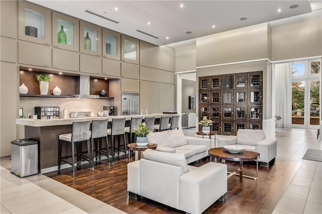 1820 Peachtree St NW Unit 804, Atlanta, GA 30309 - living room featuring a high ceiling, dark wood-style flooring, and recessed lighting
