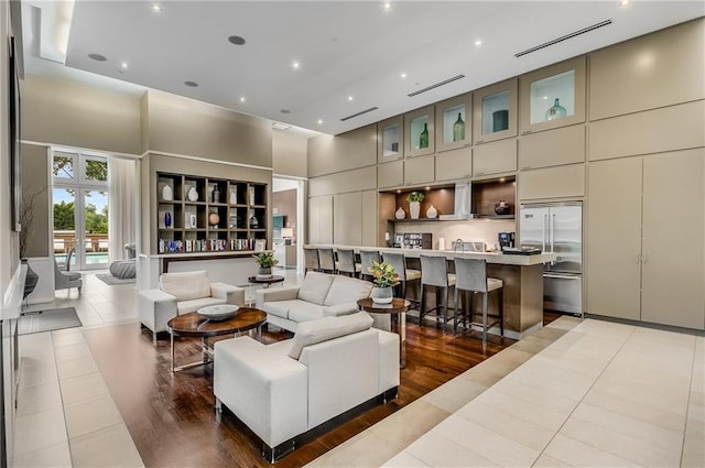 1820 Peachtree St NW Unit 804, Atlanta, GA 30309 - living area with a high ceiling, light tile patterned flooring, and recessed lighting