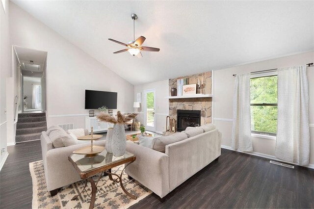 1140 Reading Dr NW, Acworth, GA 30102 - living area with a fireplace, ceiling fan, dark wood-style flooring, high vaulted ceiling, and stairway