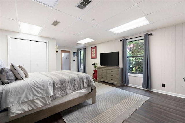 1140 Reading Dr NW, Acworth, GA 30102 - bedroom with a paneled ceiling, dark wood-style flooring, multiple windows, and a closet