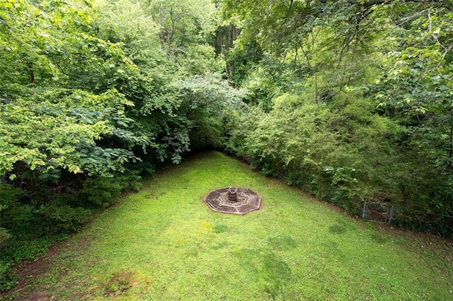 1140 Reading Dr NW, Acworth, GA 30102 - view of yard featuring an outdoor fire pit and a view of trees