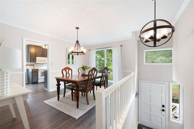 1140 Reading Dr NW, Acworth, GA 30102 - dining area with a chandelier, healthy amount of natural light, dark wood finished floors, and crown molding