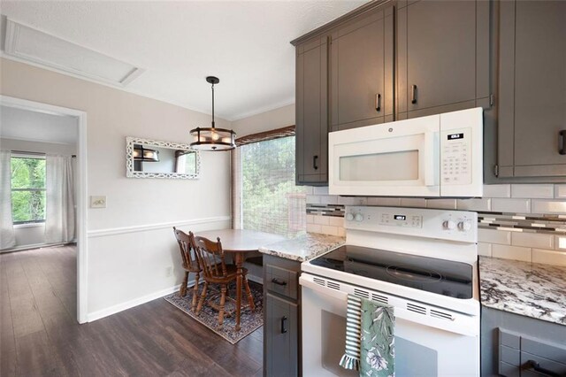 1140 Reading Dr NW, Acworth, GA 30102 - kitchen featuring white appliances, dark wood-style flooring, decorative backsplash, pendant lighting, and crown molding