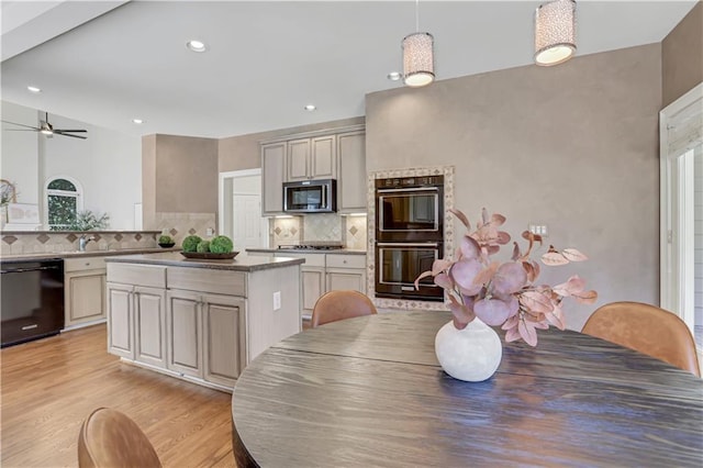 1215 Wynridge Xing, Alpharetta, GA 30005 - kitchen featuring black appliances, backsplash, light wood-style flooring, a kitchen island, and recessed lighting