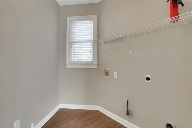 1215 Wynridge Xing, Alpharetta, GA 30005 - laundry room featuring hookup for a washing machine, hookup for a gas dryer, baseboards, hookup for an electric dryer, and wood finished floors