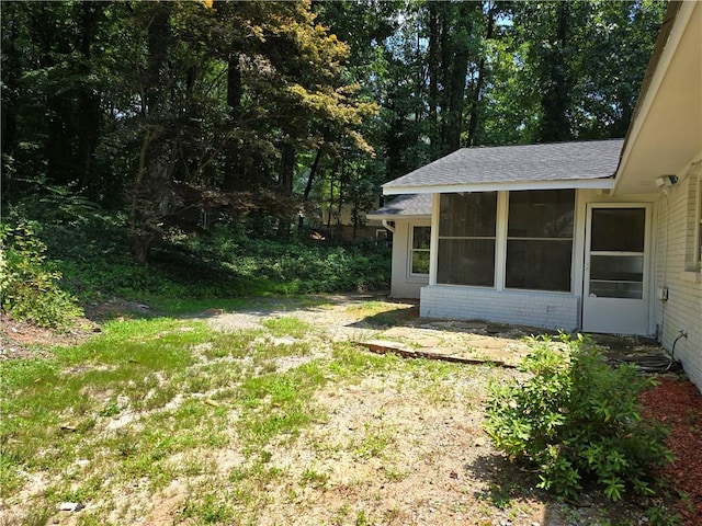 view of yard with a sunroom