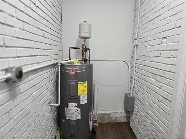 utility room with electric water heater