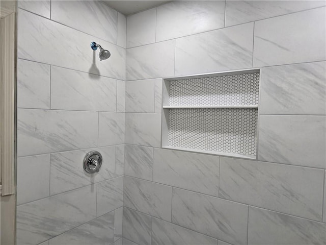 bathroom with a tile shower