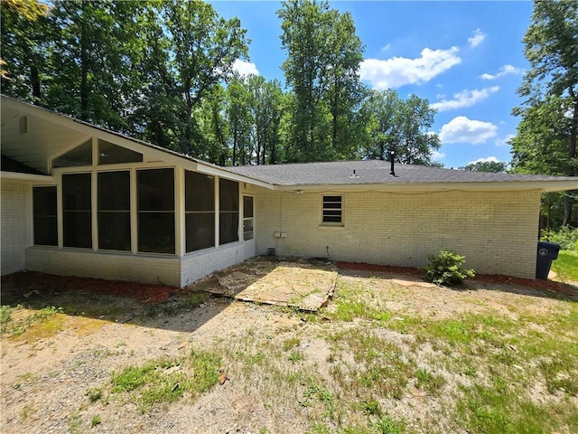 rear view of property featuring a patio area