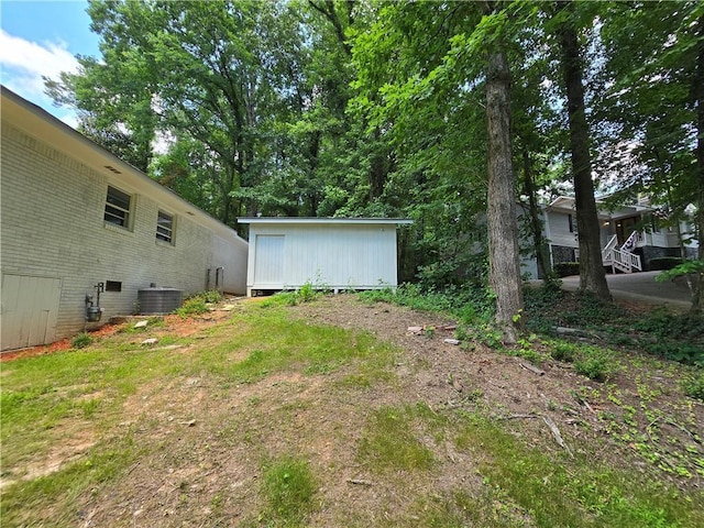 view of yard with central AC