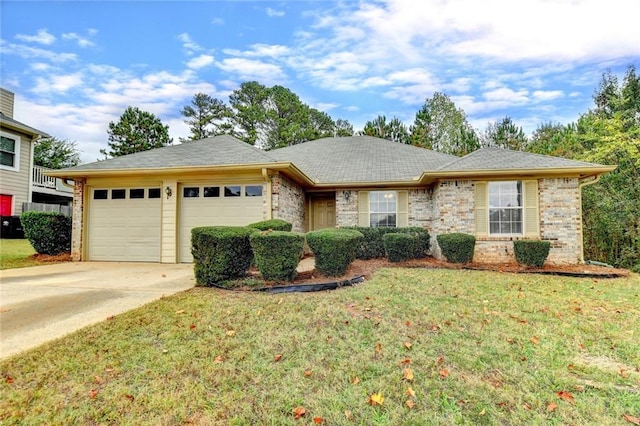 ranch-style house featuring a garage and a front yard