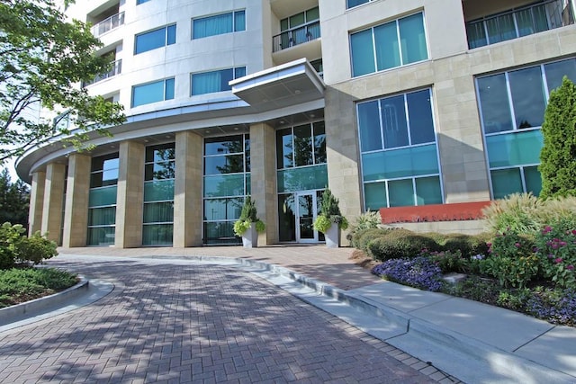 property entrance with stucco siding