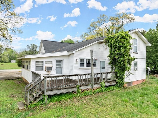 back of house with a lawn and a wooden deck