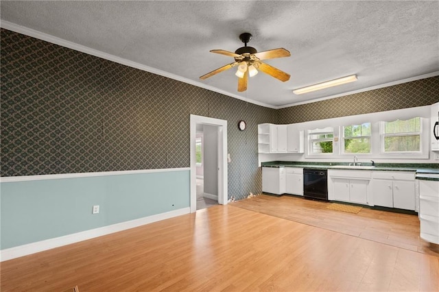 kitchen with dishwasher, white cabinetry, and crown molding