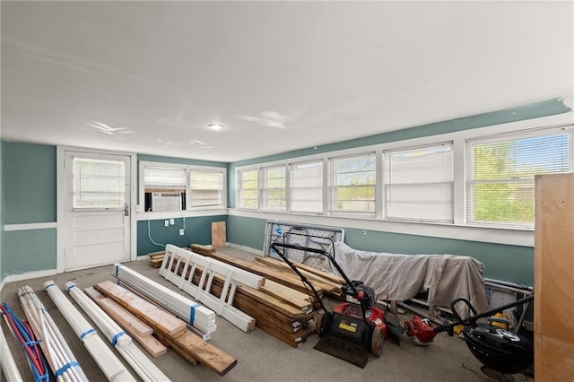 bedroom with carpet flooring and cooling unit