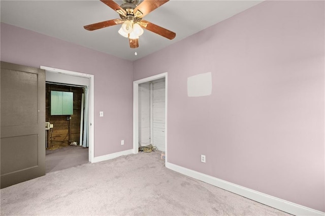 unfurnished bedroom with ceiling fan and light carpet