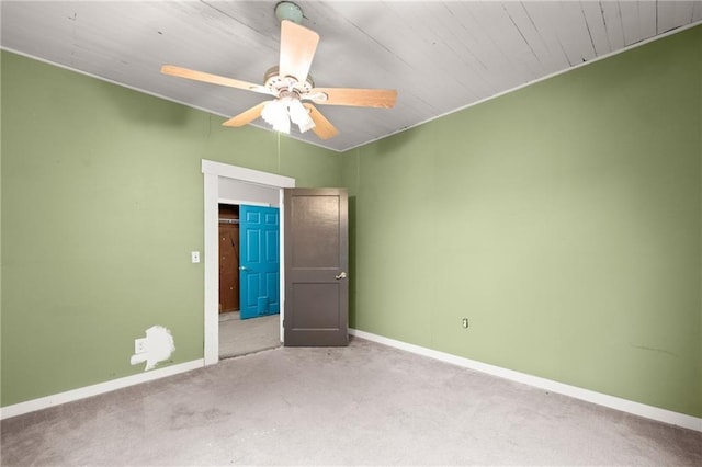 unfurnished bedroom with ceiling fan and carpet