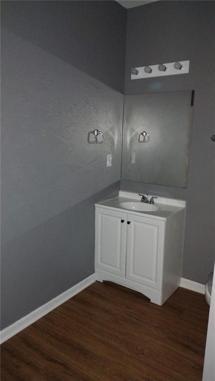 bathroom with wood-type flooring and vanity