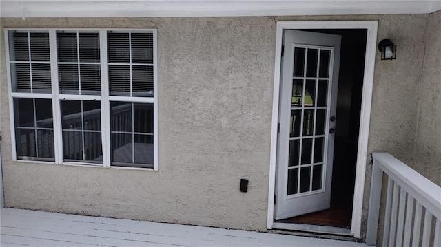 entrance to property featuring a deck