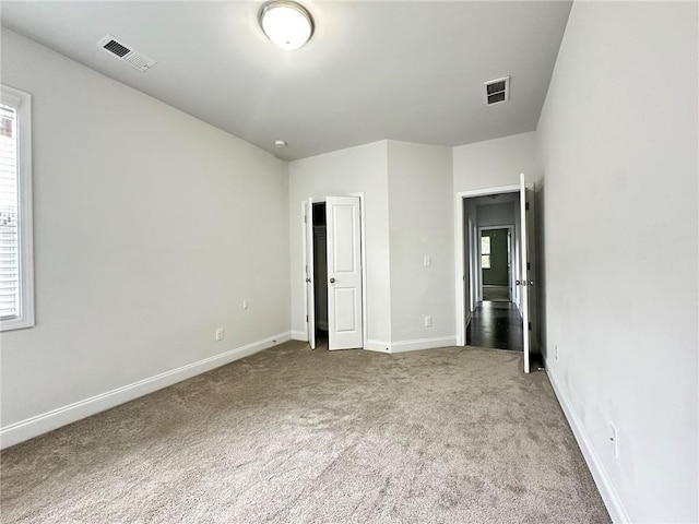 unfurnished bedroom with carpet floors