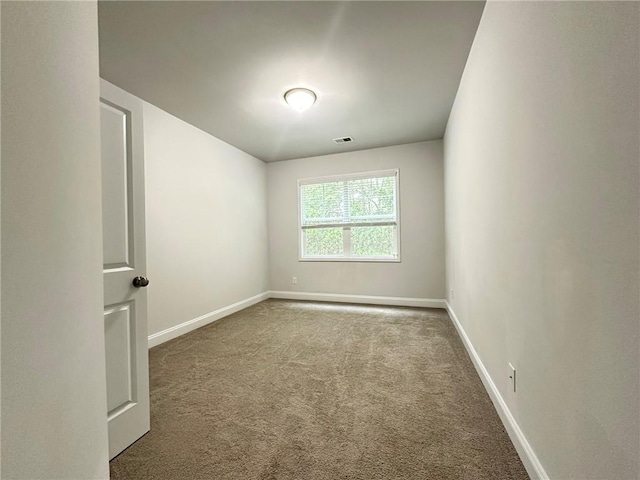 spare room featuring carpet flooring