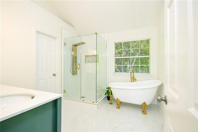 bathroom featuring a shower stall, vanity, and a soaking tub