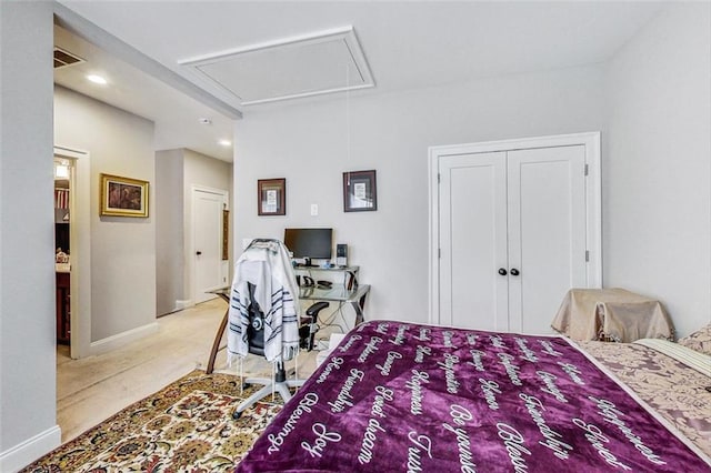 carpeted bedroom featuring a closet