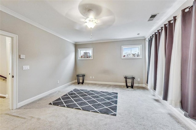 living area featuring ceiling fan, light carpet, and ornamental molding