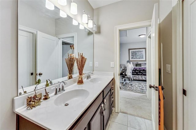 bathroom featuring tile patterned flooring and vanity