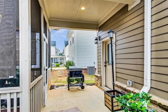 view of patio with central AC unit and a porch