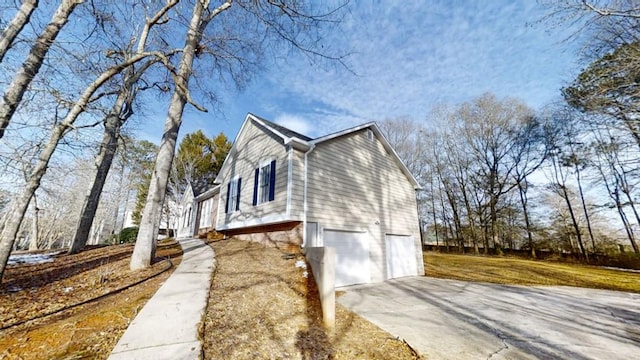 view of property exterior with a garage