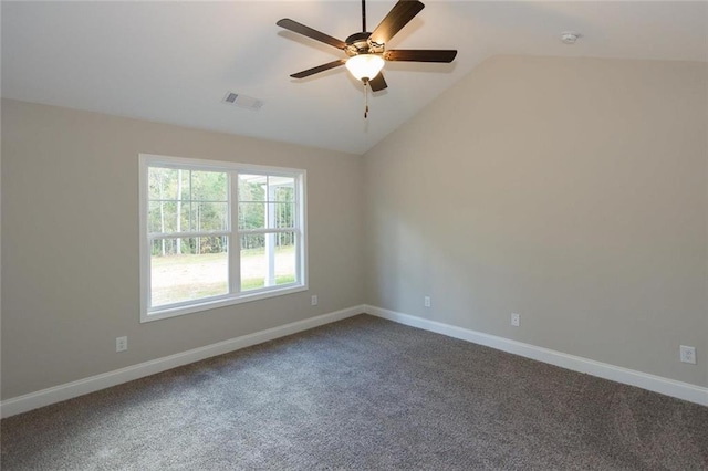 carpeted spare room featuring lofted ceiling and ceiling fan