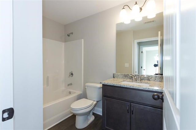 full bathroom featuring shower / tub combination, hardwood / wood-style floors, vanity, and toilet