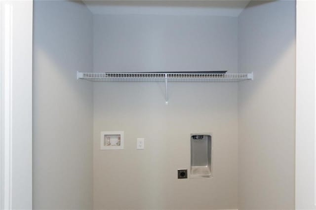 clothes washing area featuring electric dryer hookup and washer hookup