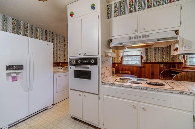 kitchen featuring extractor fan, white appliances, white cabinets, light countertops, and light floors