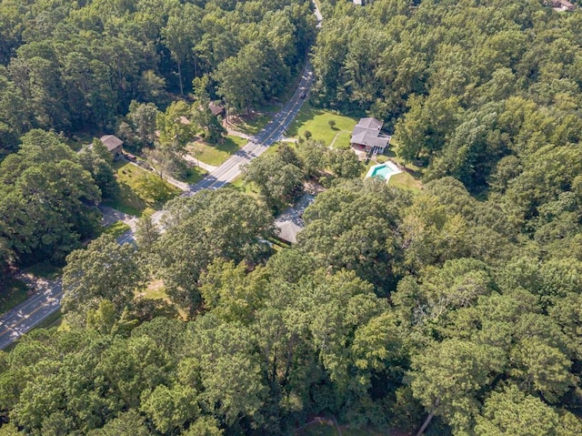 aerial view featuring a wooded view