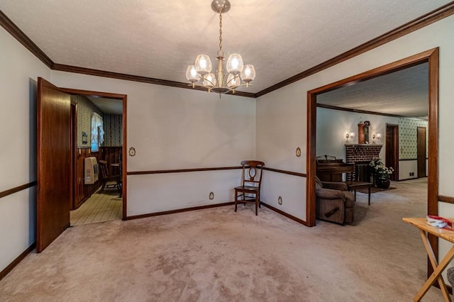 spare room featuring light carpet, baseboards, and a textured ceiling