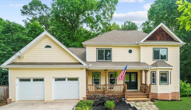 view of front of property featuring a garage and covered porch