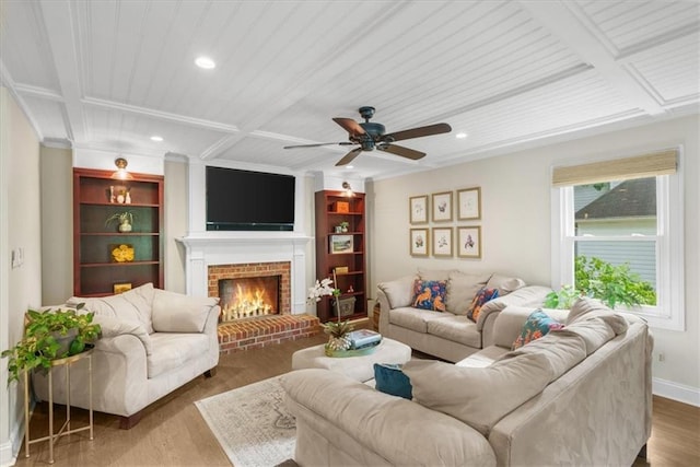 living room featuring a fireplace, beamed ceiling, hardwood / wood-style flooring, coffered ceiling, and built in shelves